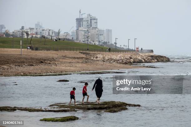 Muslims enjoy during the Eid al-Fitr holiday, at the mediterranean beachfront of the mixed Arab Jewish city of Jaffa near Tel Aviv on May 2, 2022 in...