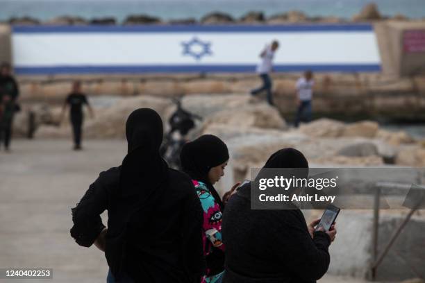 Muslims enjoy during the Eid al-Fitr holiday, at the mediterranean beachfront of the mixed Arab Jewish city of Jaffa near Tel Aviv on May 2, 2022 in...