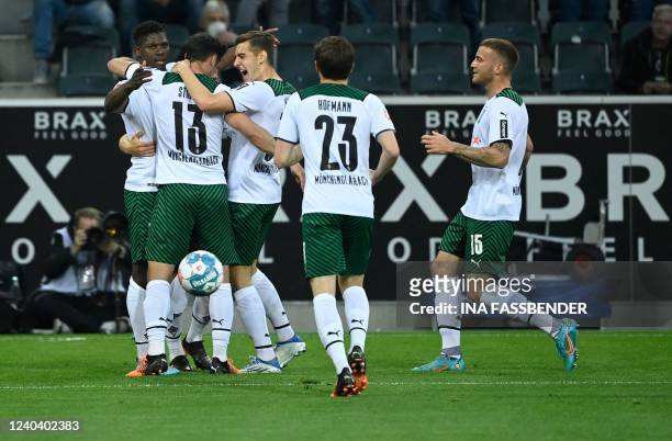 Moenchengladbach's Swiss forward Breel Embolo celebrates scoring the opening goal with teammates during the German first division Bundesliga football...