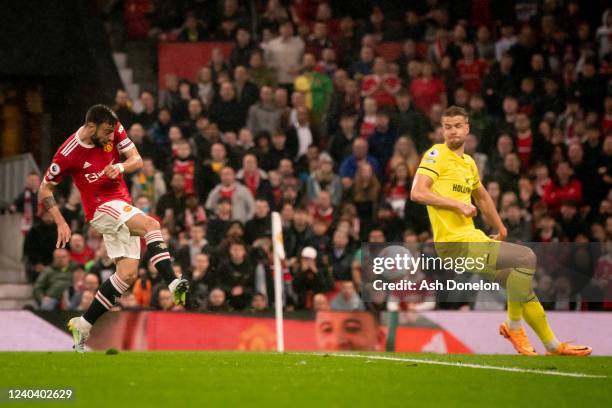 Bruno Fernandes of Manchester United scores a goal to make the score 1-0 during the Premier League match between Manchester United and Brentford at...