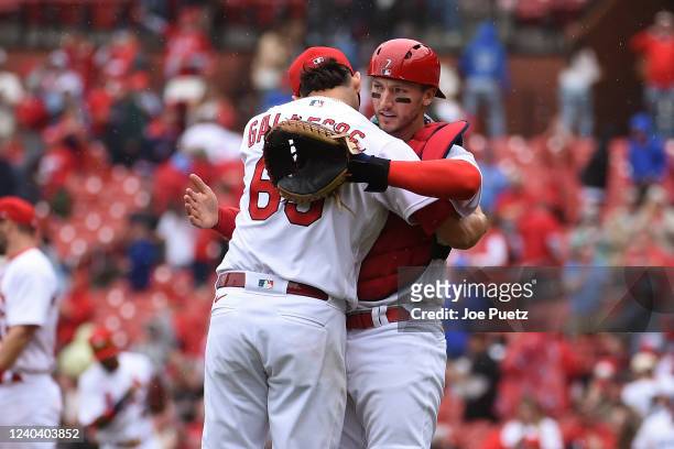 Giovanny Gallegos and Andrew Knizner of the St. Louis Cardinals celebrate a 1-0 victory over the Kansas City Royals at Busch Stadium on May 2, 2022...