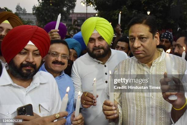 Former Punjab Congress president Navjot Singh Sidhu along with party leaders and supporters taking out a candle light march for unity, peace and...