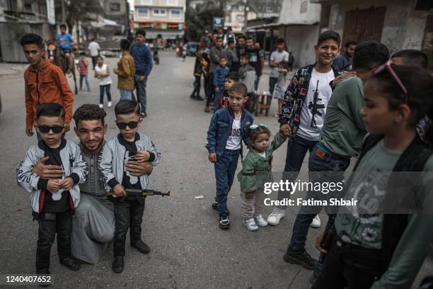 Palestinians enjoy their time on the first day of Eid al-Fitr in Jabalia refugee camp in the northern Gaza Strip on May 2, 2022 in Gaza City, Gaza....