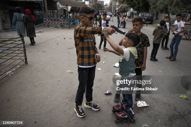 Palestinians enjoy their time on the first day of Eid al-Fitr in Jabalia refugee camp in the northern Gaza Strip on May 2, 2022 in Gaza City, Gaza....