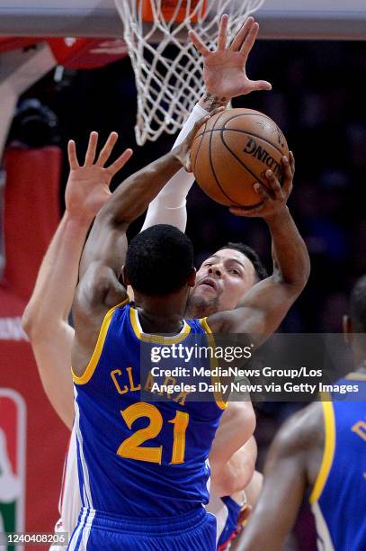 Los Angeles, CA Los Angeles Clippers guard JJ Redick blocks the shot of Golden State Warriors guard Ian Clark during their NBA basketball game at the...