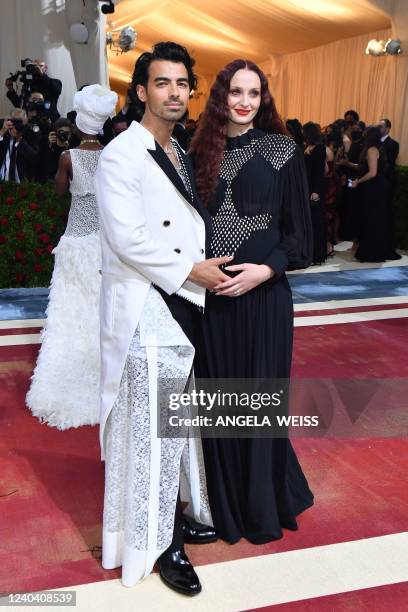 Musician-actor Joe Jonas and wife English actress Sophie Turner arrive for the 2022 Met Gala at the Metropolitan Museum of Art on May 2 in New York....