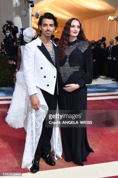 Musician-actor Joe Jonas and wife English actress Sophie Turner arrive for the 2022 Met Gala at the Metropolitan Museum of Art on May 2 in New York....