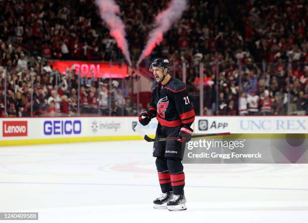 Nino Niederreiter of the Carolina Hurricanes scores a goal and celebrates in Game One of the First Round of the 2022 Stanley Cup Playoffs against the...