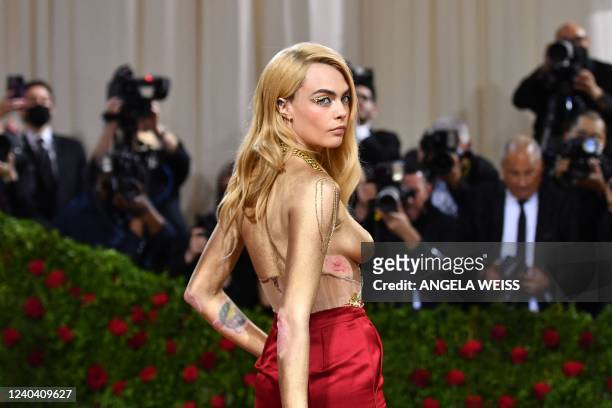 British model Cara Delevingne arrives for the 2022 Met Gala at the Metropolitan Museum of Art on May 2 in New York. - The Gala raises money for the...