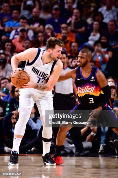 Chris Paul of the Phoenix Suns plays defense on Luka Doncic of the Dallas Mavericks during Game 1 of the 2022 NBA Playoffs Western Conference...