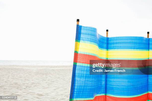 wind break on beach - beach shelter stockfoto's en -beelden