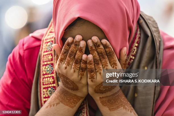 Muslim devotees offer a special morning prayer to start the Eid al-Fitr festival, which marks the end of their holy fasting month of Ramadan, at...