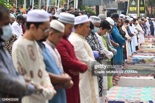 Muslim devotees offer special morning prayers to start the Eid al-Fitr festival, which marks the end of their holy fasting month of Ramadan, at...