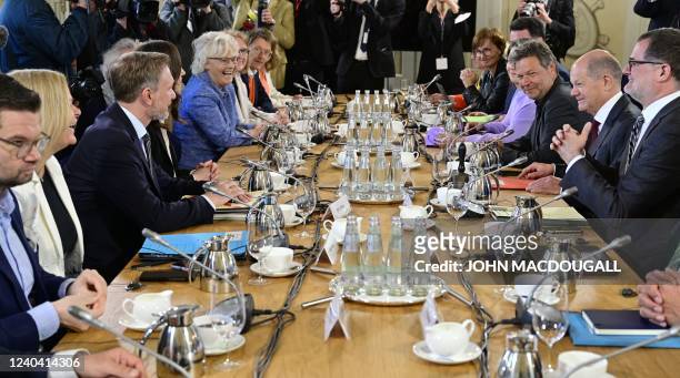 Cabinet members, among them German Interior Minister Nancy Faeser , Finance Minister Christian Lindner , Defence Minister Christine Lambrecht ,...