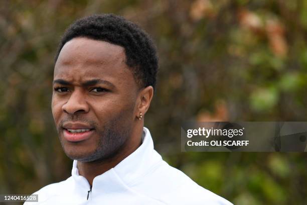 Manchester City's English midfielder Raheem Sterling reacts takes part in a training session at the Manchester City training ground in Manchester,...