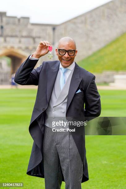 Jay Blades with their MBE , awarded by Prince of Wales during an investiture ceremony at Windsor Castle on May 3, 2022 in London, England.
