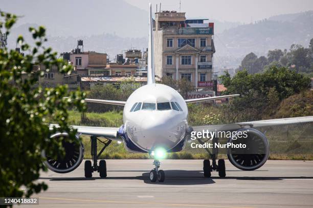 Indigo Airbus A320neo aircraft as seen on the runway and taxiway taxiing for departure at Kathmandu Tribhuvan International Airport. The modern and...