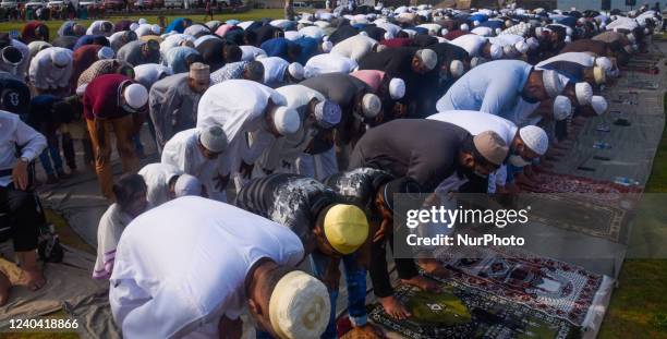 Sri Lankan Muslims devotees offer Eid prayers on the first day of the Eid al-Fitr festival at the Galle Face esplanade in Colombo on May 3, 2022. The...