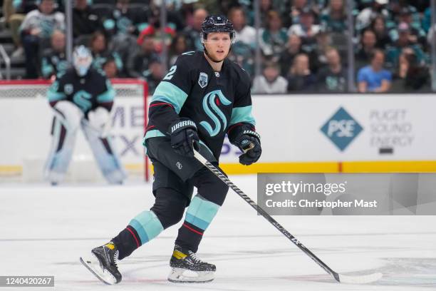 Dennis Cholowski of the Seattle Kraken skates back on defense during the third period of a game against the San Jose Sharks at Climate Pledge Arena...