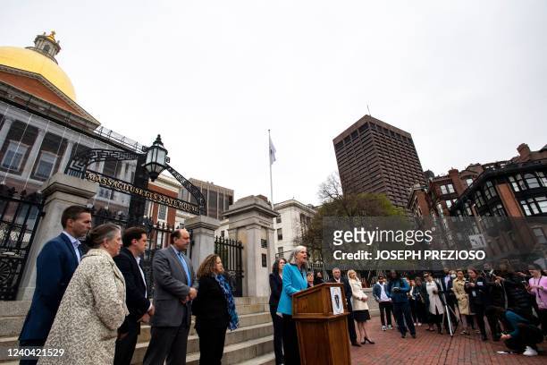 Congresswoman Katherine Clark speaks to media and dozens of people who gathered at the state House to listen to local officials speak during a press...