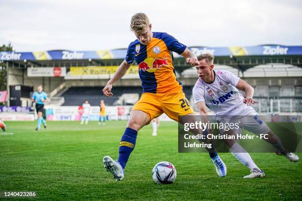 Lukas Ibertsberger of FC Liefering in action against Moritz Würdinger of FC Juniors OOe during the 2. Liga match between FC Juniors OOe and FC...