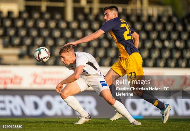Erwin Softic of FC Juniors OOe in action against Roko Simic of FC Liefering during the 2. Liga match between FC Juniors OOe and FC Liefering at...