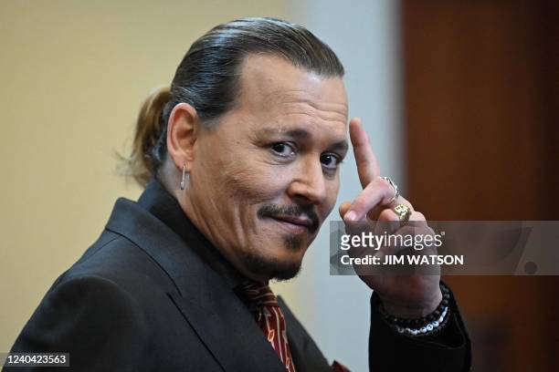 Actor Johnny Depp looks on during a hearing at the Fairfax County Circuit Courthouse in Fairfax, Virginia, on May 3, 2022. - US actor Johnny Depp...