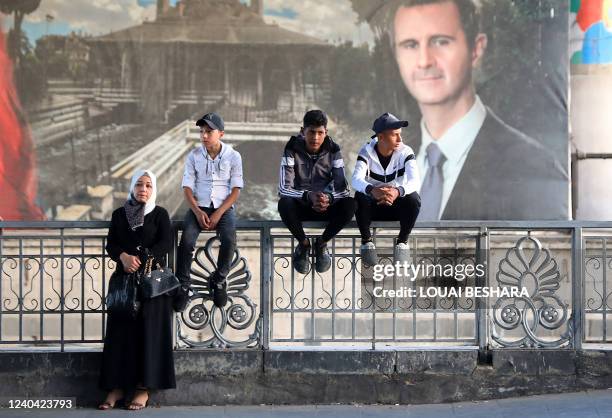 Syrians await the release of relatives held in regime prisons, on May 3, 2022 in the centre of Damascus, after a general amnesty was issued by the...