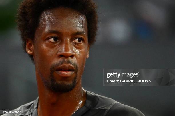 France's Gael Monfils reacts as he plays against Serbia's Novak Djokovic during their 2022 ATP Tour Madrid Open tennis tournament singles match at...