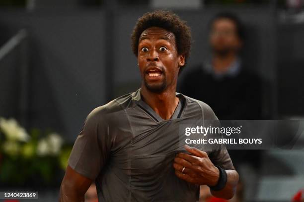 France's Gael Monfils reacts as he plays against Serbia's Novak Djokovic during their 2022 ATP Tour Madrid Open tennis tournament singles match at...