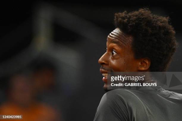 France's Gael Monfils reacts as he plays against Serbia's Novak Djokovic during their 2022 ATP Tour Madrid Open tennis tournament singles match at...