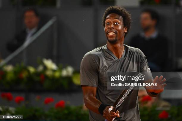 France's Gael Monfils reacts as he plays against Serbia's Novak Djokovic during their 2022 ATP Tour Madrid Open tennis tournament singles match at...