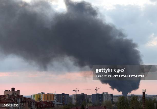 Dark smoke rises following an air strike in the western Ukrainian city of Lviv, on May 3, 2022.