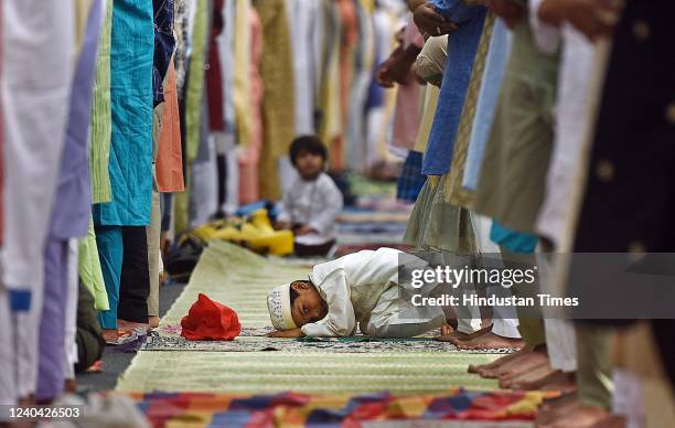 Child offers prayers on the occasion of Eid al-Fitr at Hahadur Jaha Zafar Marg outside the Masjid Bhoori Bhatiyar mosque on May 3, 2022 in New Delhi,...