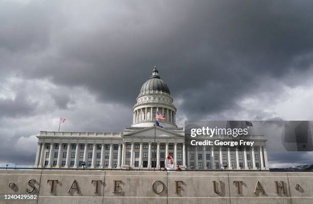 Women takes a picture at the Utah State Capitol where protesters show their support for Roe v. Wade and abortion on May 3, 2022 in Salt Lake City,...