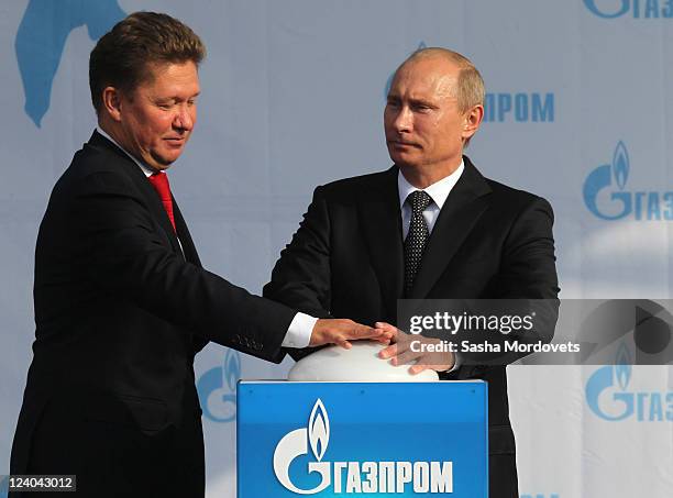 Russian Prime Minister Vladimir Putin and CEO of Russian natural gas giant Gazprom Alexei Miller attend a ceremony to mark the launch of the...