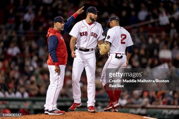Michael Wacha of the Boston Red Sox walks off the mound as manager Alex Cora of the Boston Red Sox calls to the bullpen during the sixth inning of a...