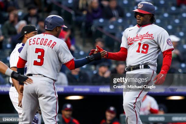 Josh Bell of the Washington Nationals celebrates with Alcides Escobar of the Washington Nationals after hitting a three-run home run against the...