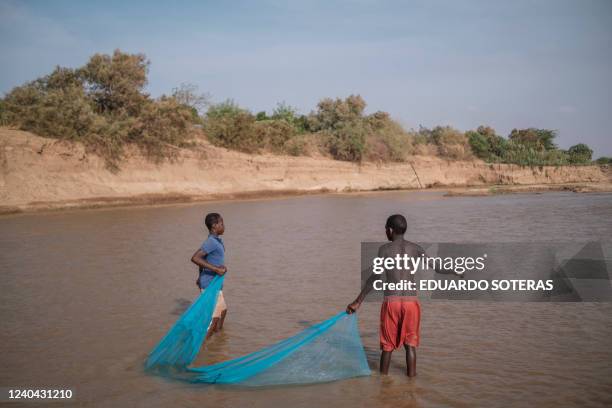 Youngsters hold a fishing net in the Shabelle river in the city of Gode, Ethiopia, on April 8, 2022. The worst drought to hit the Horn of Africa for...
