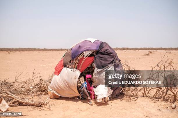 Woman sits in a tent in the camp for internally displaced people of Farburo 2 in the village of Adlale, near the city of Gode, Ethiopia, on April 6,...