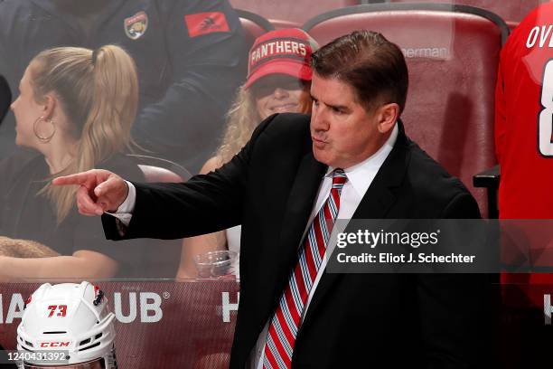 Washington Capitals Head Coach Peter Laviolette directs his team from the bench against the Florida Panthers in Game One of the First Round of the...