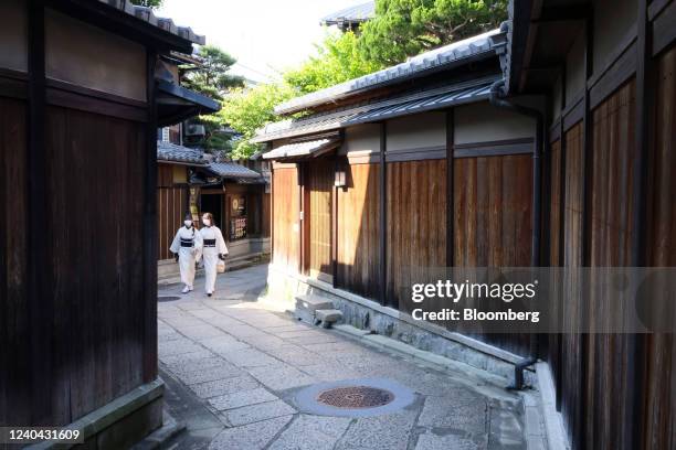 Tourists wearing Kimonos walk through Ichinenzaka near Kodaiji temple during Golden Week holidays in Kyoto, Japan, on Tuesday, May 2022. Japans...