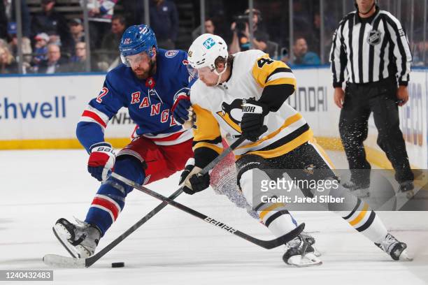 Patrik Nemeth of the New York Rangers battles for the puck against Kasperi Kapanen of the Pittsburgh Penguins in Game One of the First Round of the...