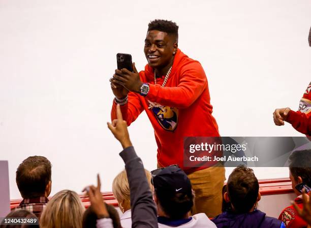 Rapper Kodak Black takes photos with fans during the third period of Game One of the First Round of the 2022 NHL Stanley Cup Playoffs between the...