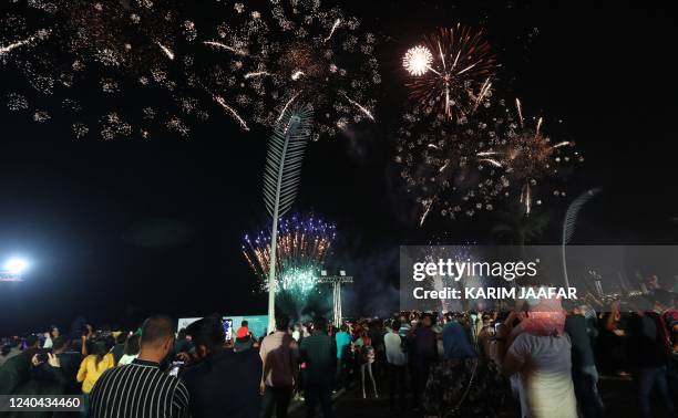 Qataris and residents of the Gulf emirate celebrate Eid al-Fitr with fireworks on the seaside promenade in the captial Doha late on May 3, 2022. -...