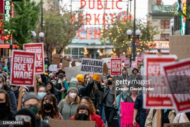 Demonstrators march following a rally in support of abortion rights near Pike Place Market on May 3, 2022 in Seattle, Washington. A leaked draft...