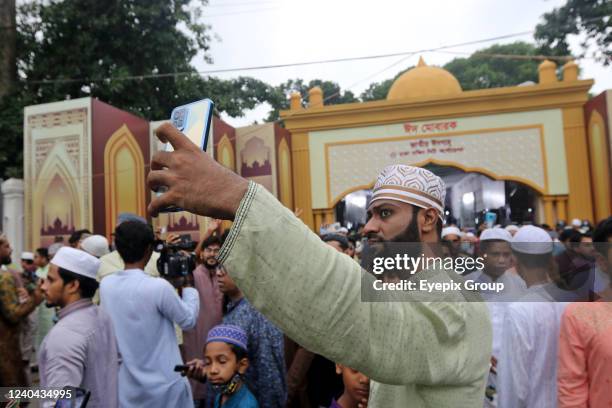 Muslim devotees offer a special morning prayer to start the Eid al-Fitr festival, which marks the end of their holy fasting month of Ramadan, at...