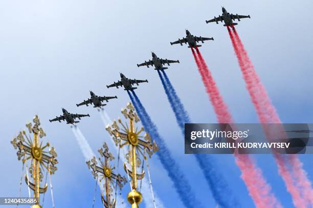 Russian Sukhoi Su-25 assault aircrafts release smoke in the colours of the Russian flag while flying over downtown Moscow during a rehearsal for the...