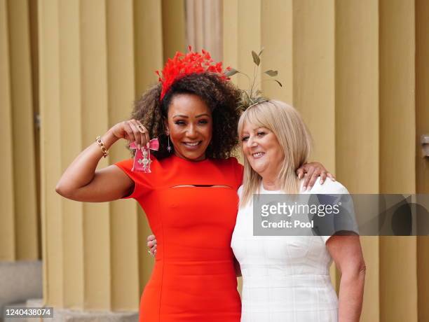Former Spice Girl Melanie Brown poses with her mother Andrea Brown after she was made an MBE by the Duke of Cambridge during an investiture ceremony...