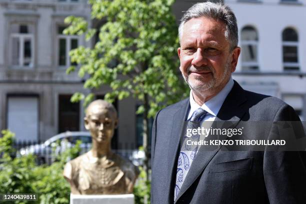 Sean Hepburn Ferrer, son of late Hollywood British actress Audrey Hepburn poses in front of a statue of his mother, made by Dutch artist Kees...